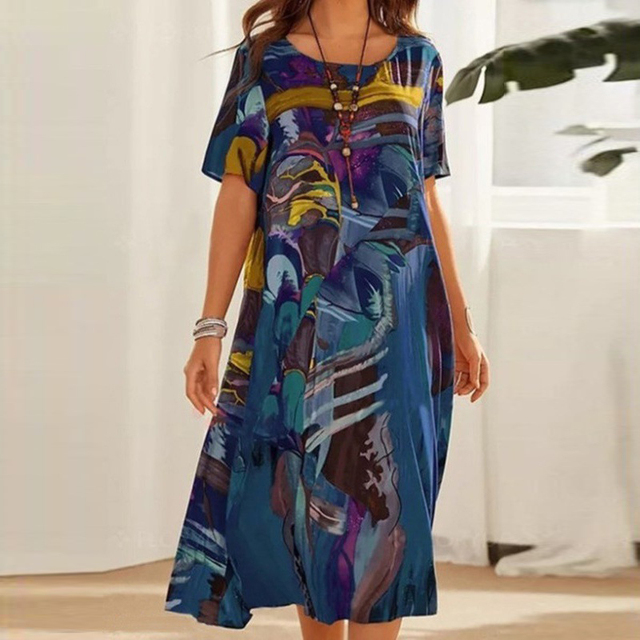 Blue and teal printed midi dress with short sleeves and scoop neckline