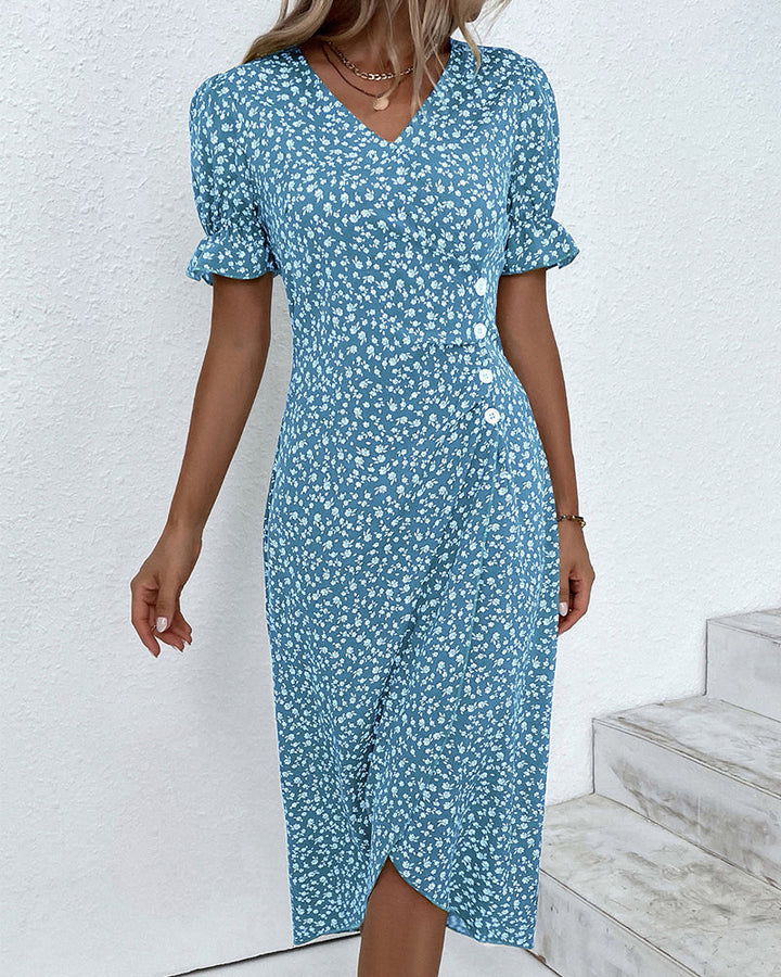 Blue v-neck midi dress with white floral print, button front, short puff sleeves