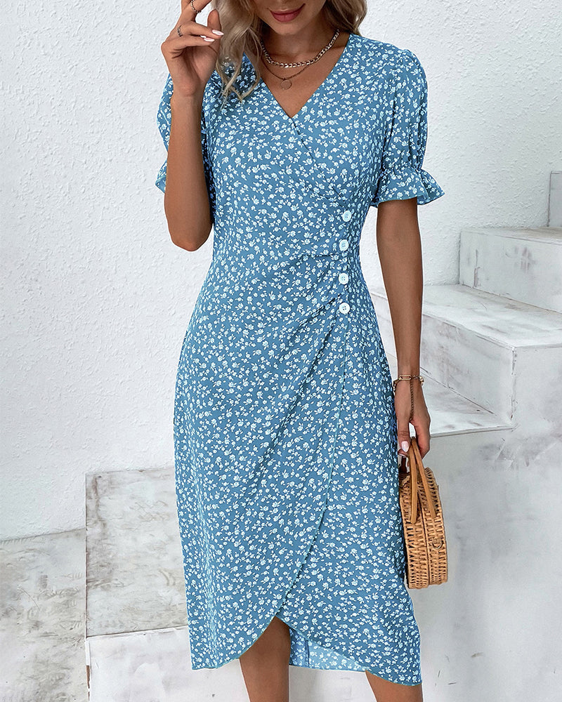 Blue v-neck midi dress with white floral print, button front, short puff sleeves