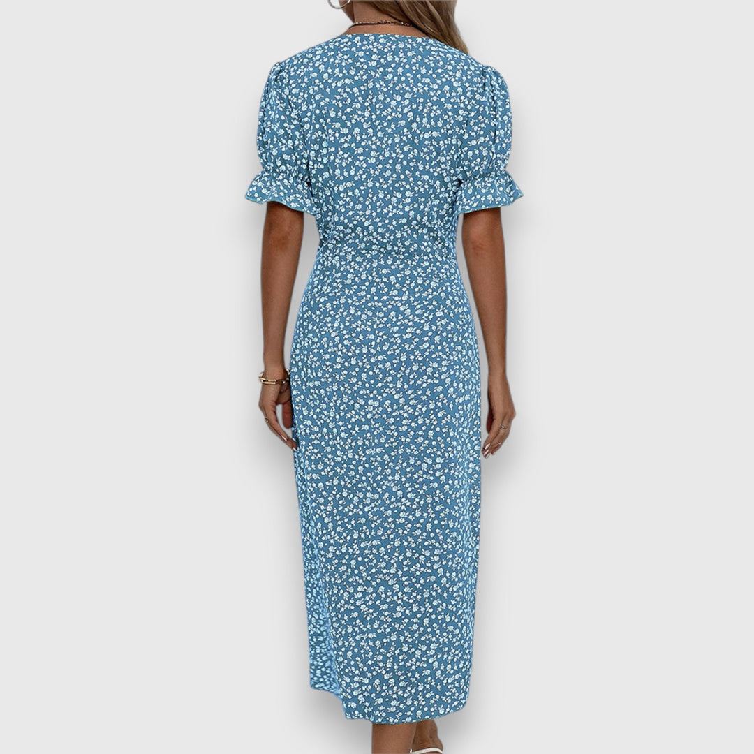 Blue floral midi dress, back view, ruffled short sleeves and gathered waist