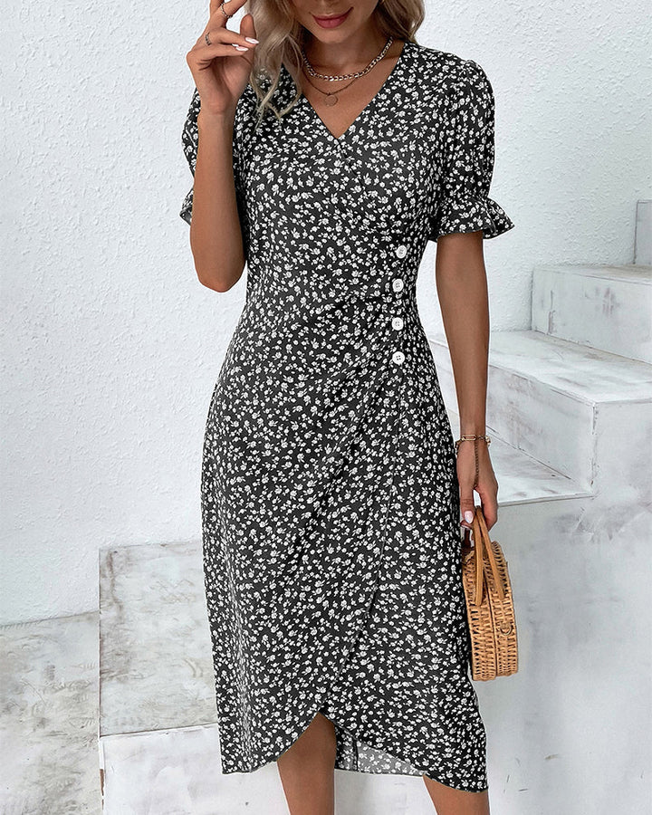 Black v-neck midi dress with white floral print, button front, short puff sleeves