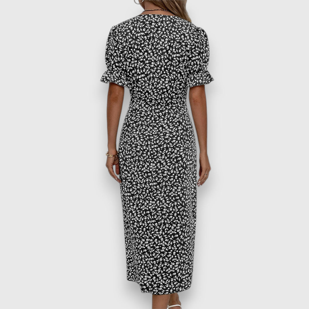 Black floral midi dress, back view, ruffled short sleeves and gathered waist
