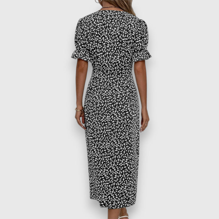 Black floral midi dress, back view, ruffled short sleeves and gathered waist