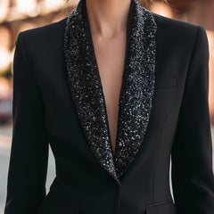 Black tailored blazer with shimmering sequin notched lapels, close-up front view
