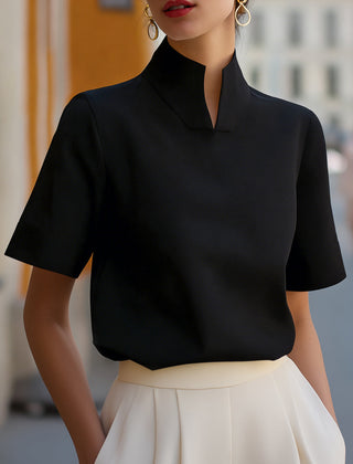 Black structured blouse with stand collar and short sleeves, smooth minimalist front