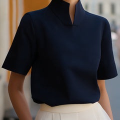 Navy structured blouse with stand collar and short sleeves, smooth minimalist front