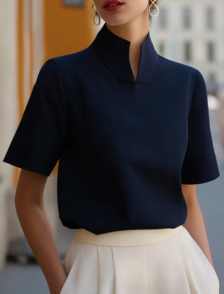 Navy structured blouse with stand collar and short sleeves, smooth minimalist front