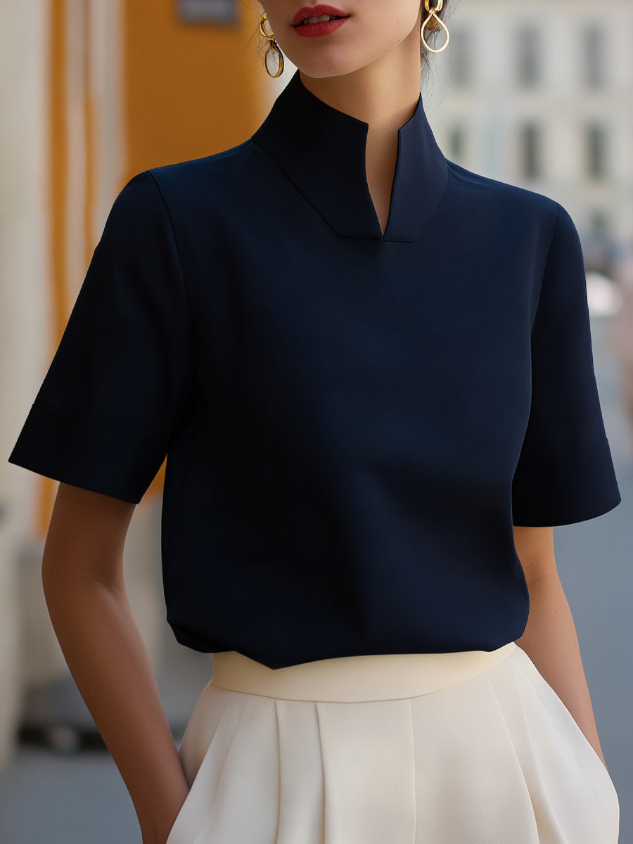 Navy structured blouse with stand collar and short sleeves, smooth minimalist front