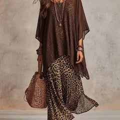 Brown bohemian maxi dress with leopard print skirt, sheer cape sleeves, tiered hem