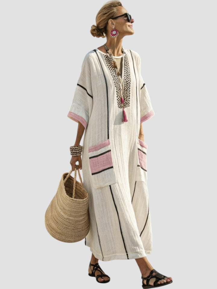 Cream V-neck midi dress with pink and gray striped trim and side pocket panels