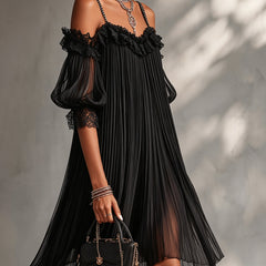 Black off-shoulder lace dress with ruffled neckline, pleated layers, and lace cuffs