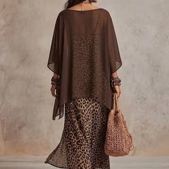 Brown bohemian maxi dress back view with leopard print hem, sheer cape sleeves, tiered