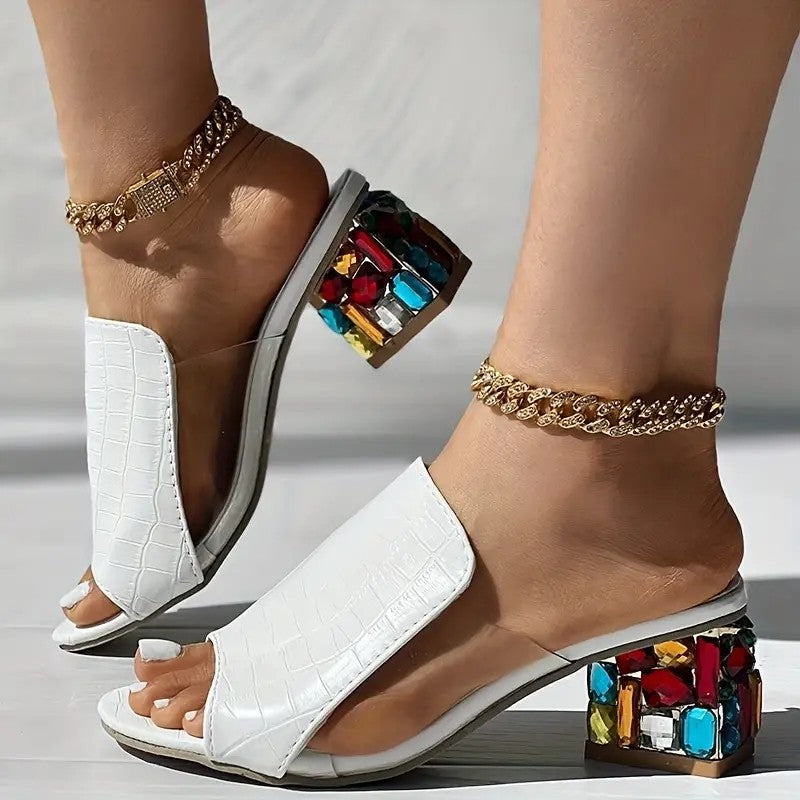 White croc-texture slide heels with colorful jewel block heel, open toe and side view