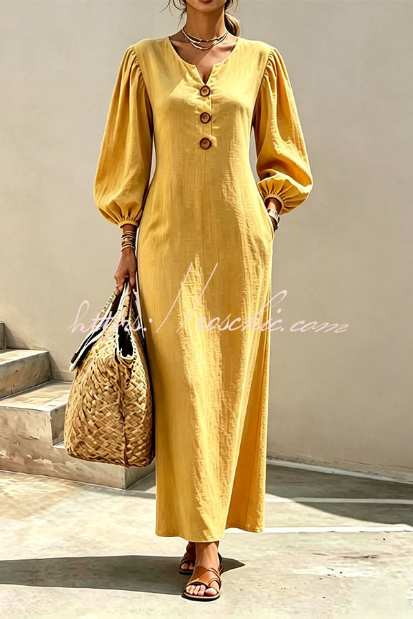 Yellow v-neck maxi dress with button front and lantern sleeves