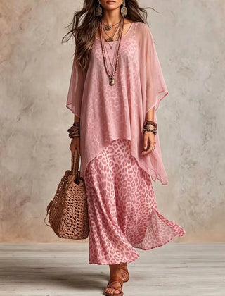 Pink bohemian maxi dress with pink leopard print skirt, sheer cape sleeves, tiered hem
