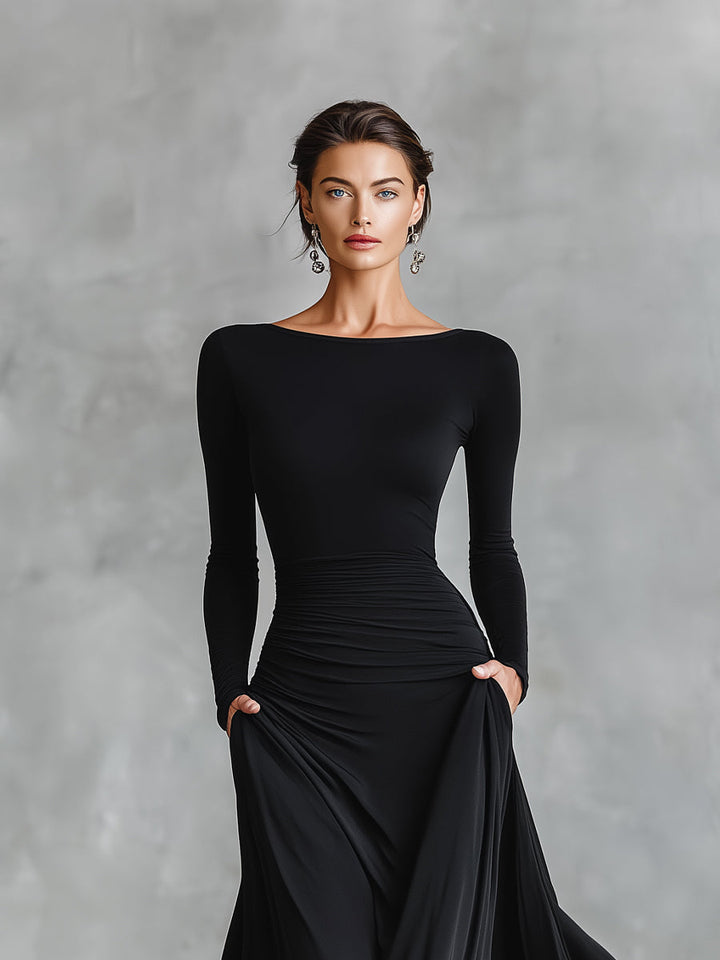 Black long-sleeve maxi dress with round neckline, ruched waist, draped front skirt