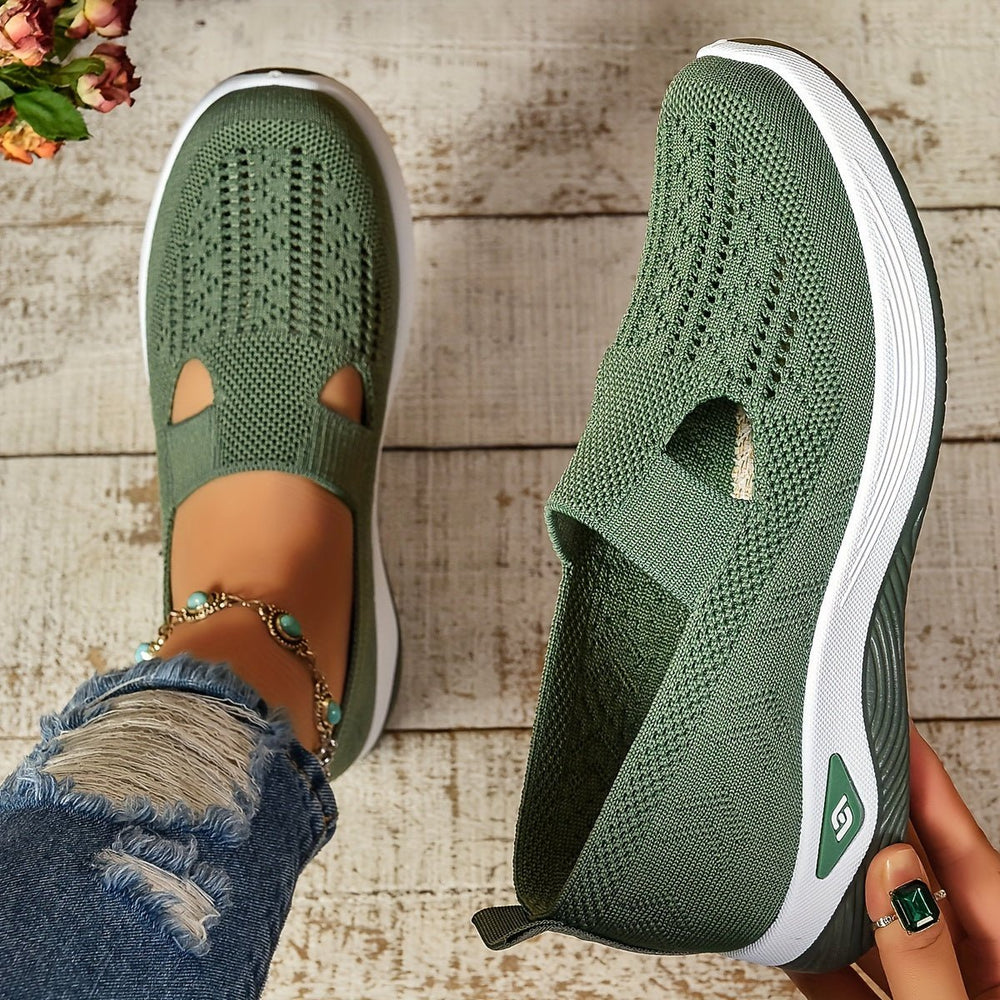 Green knit orthopedic slip-on shoes with oval cutouts and white sole
