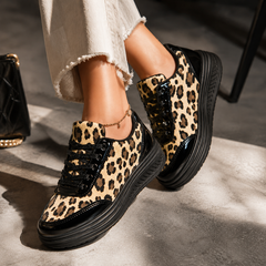 Leopard print platform sneakers with black laces and dark rubber sole