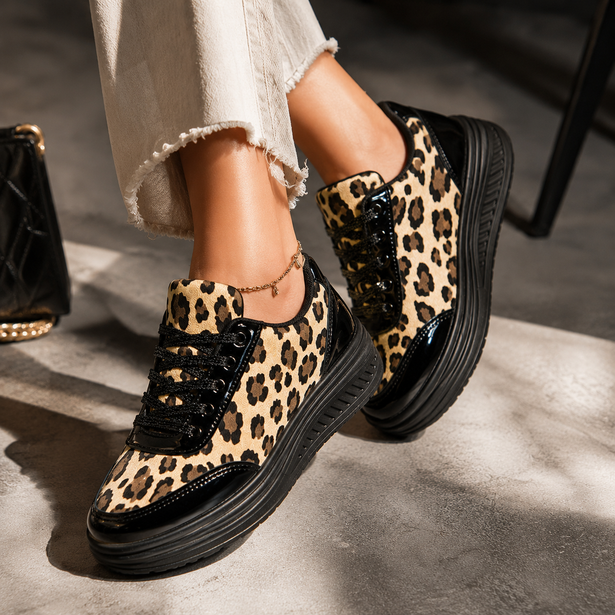 Leopard print platform sneakers with black laces and dark rubber sole