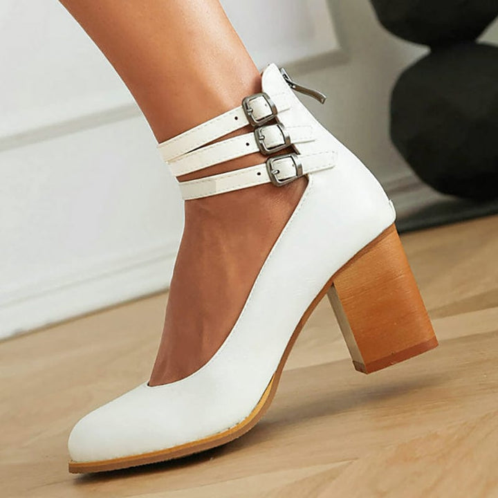 White triple-buckle ankle strap heels with block heel