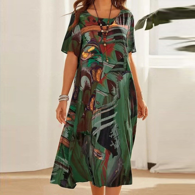 Green printed midi dress with short sleeves and scoop neckline, buttoned front