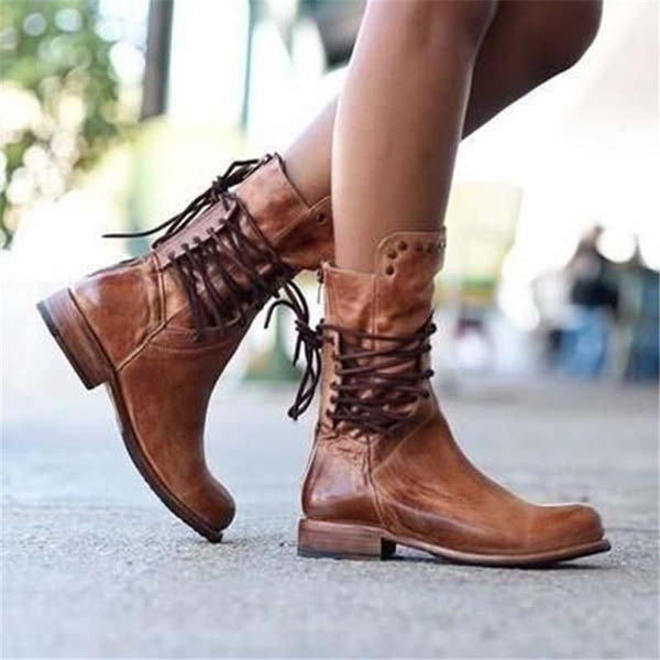 Vintage lace-up boots in brown leather with black laces and stitched toe