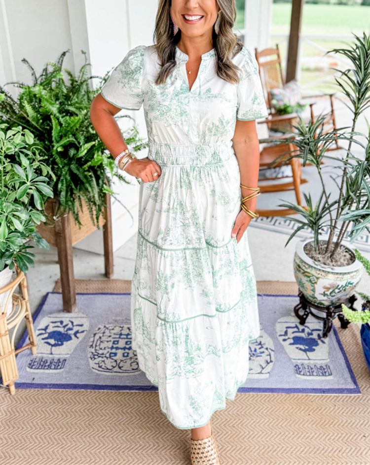 Tiered maxi dress with short sleeves and V-neck, white base with green toile print
