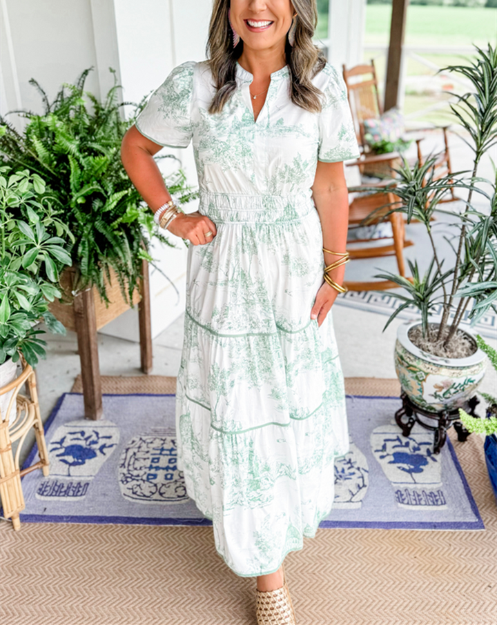 Tiered maxi dress with short sleeves and V-neck, white base with green toile print