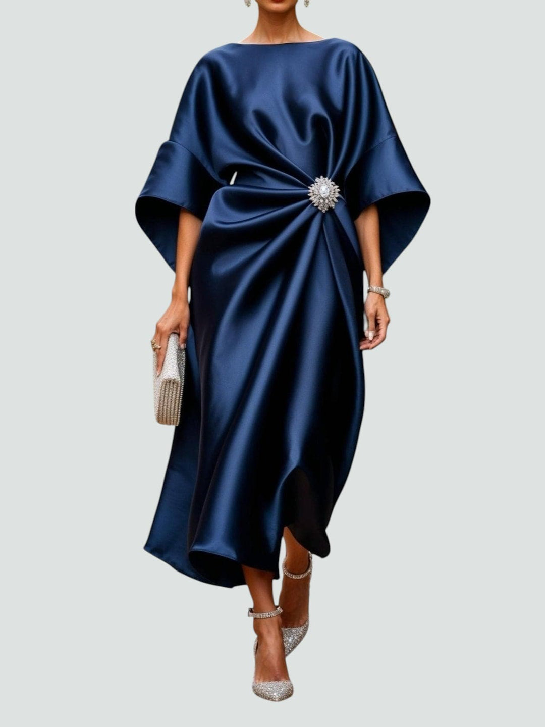 Navy satin midi dress with dolman sleeves and jeweled waist brooch