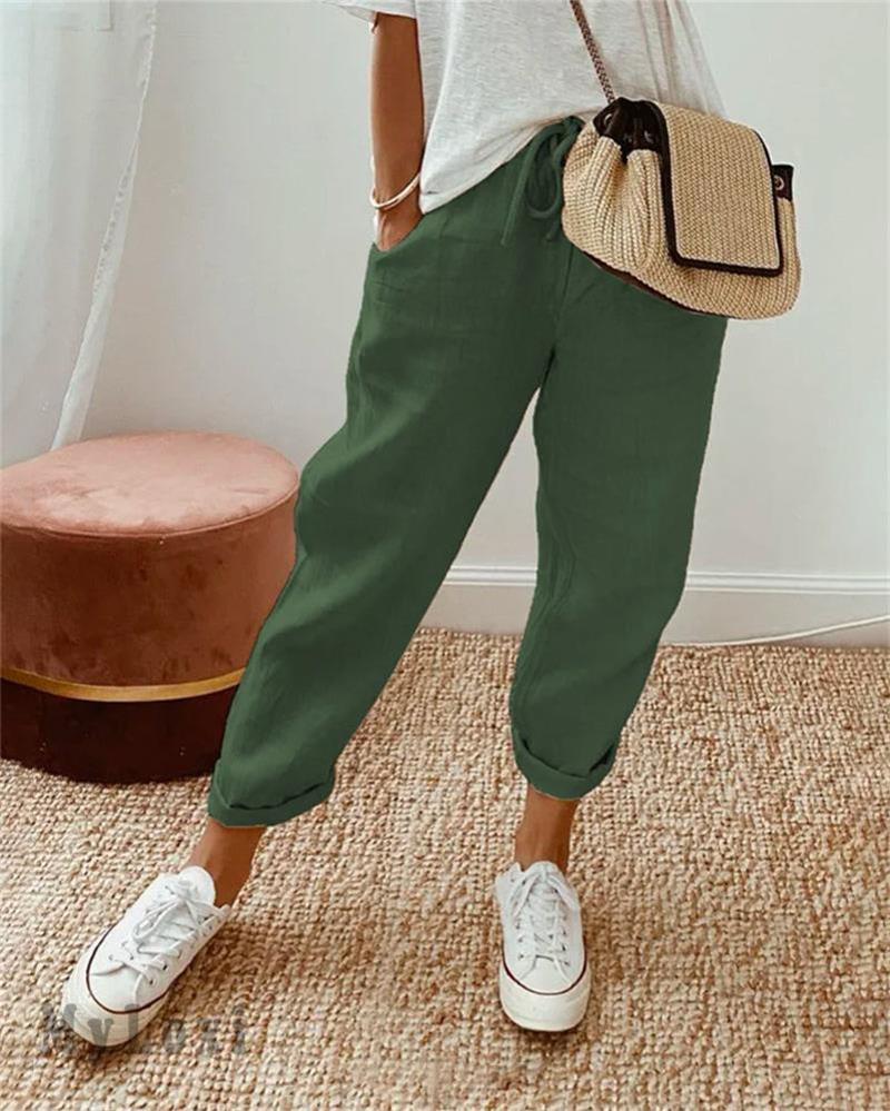 Green casual pants with drawstring waist and cuffed ankle hem.