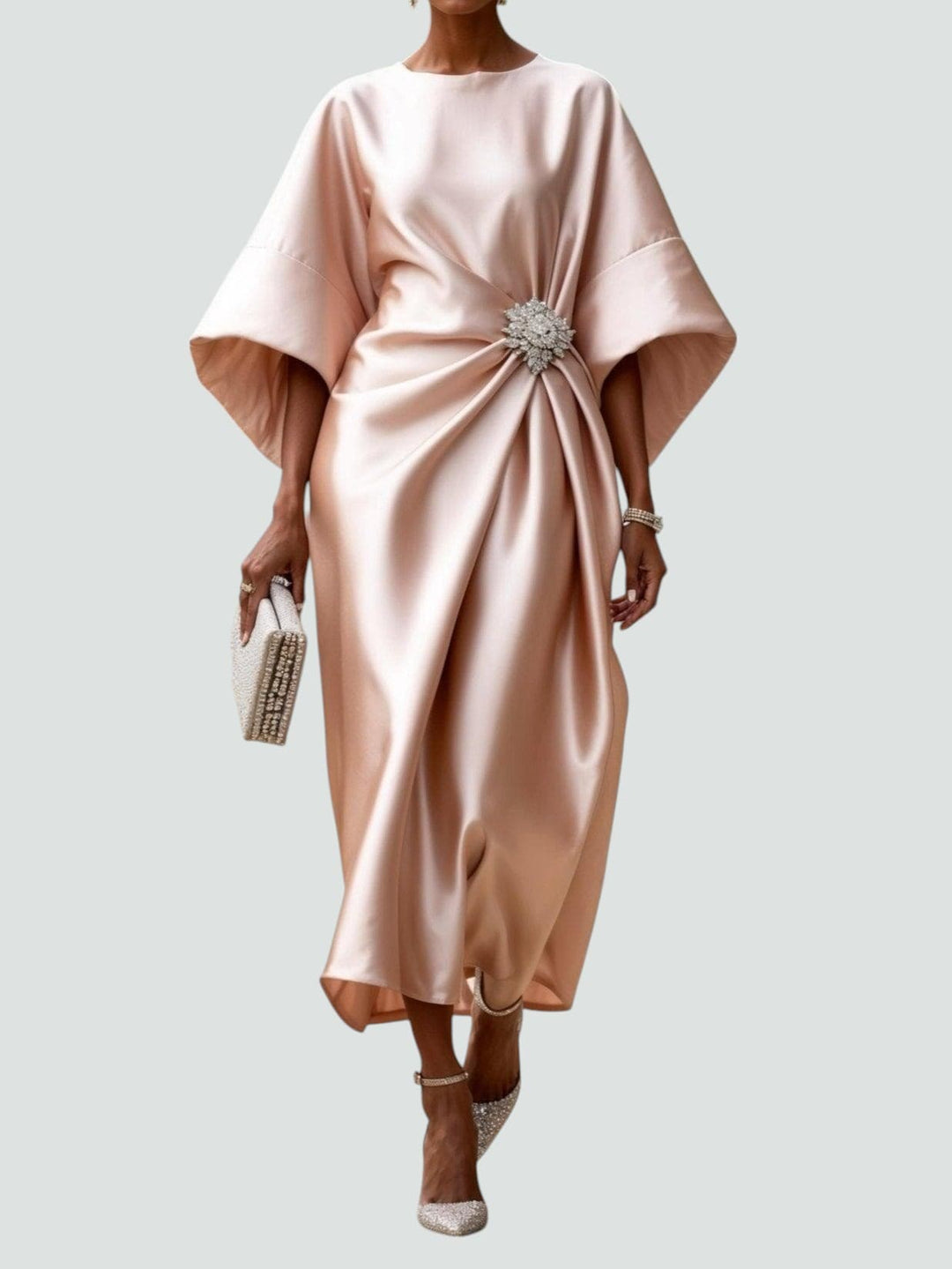 Beige satin midi dress with dolman sleeves and jeweled waist brooch