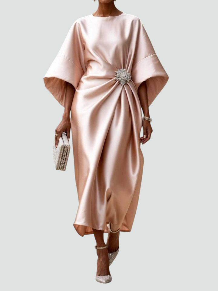 Beige satin midi dress with dolman sleeves and jeweled waist brooch