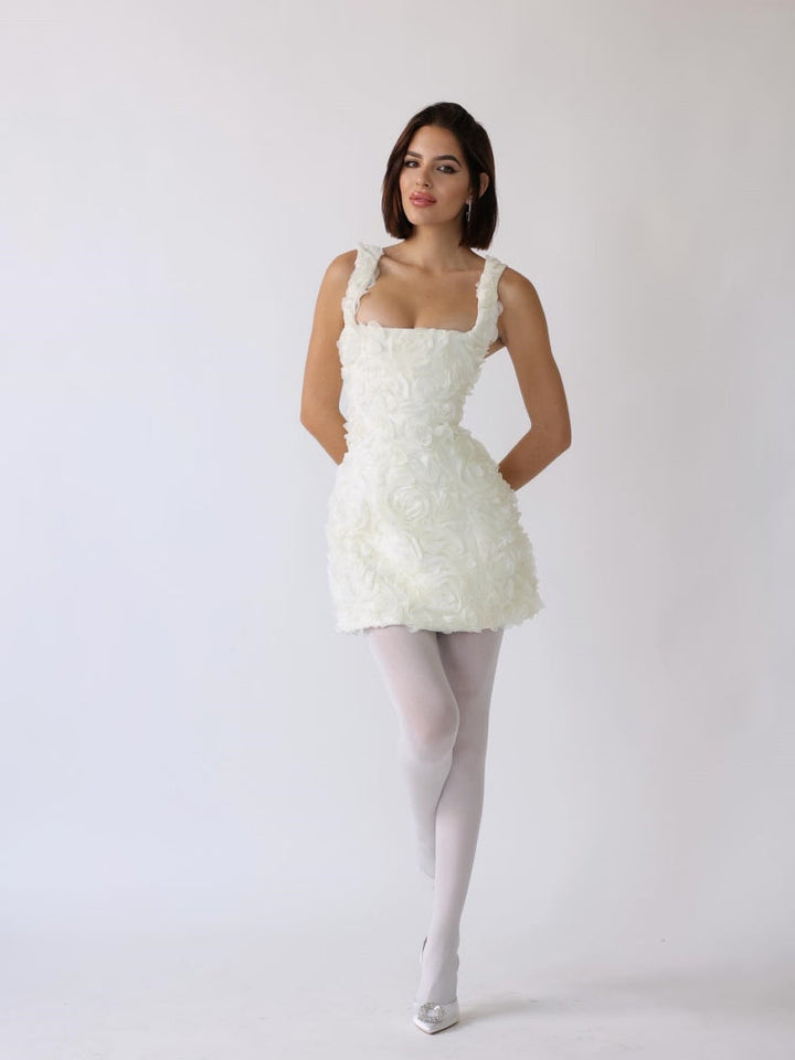 White corset mini dress with square neckline and textured rosette overlay