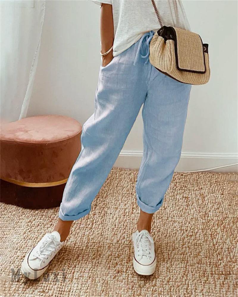 Light blue casual pants with drawstring waist and cuffed ankle hem.