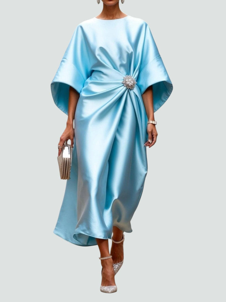Light blue satin midi dress with dolman sleeves and jeweled waist brooch
