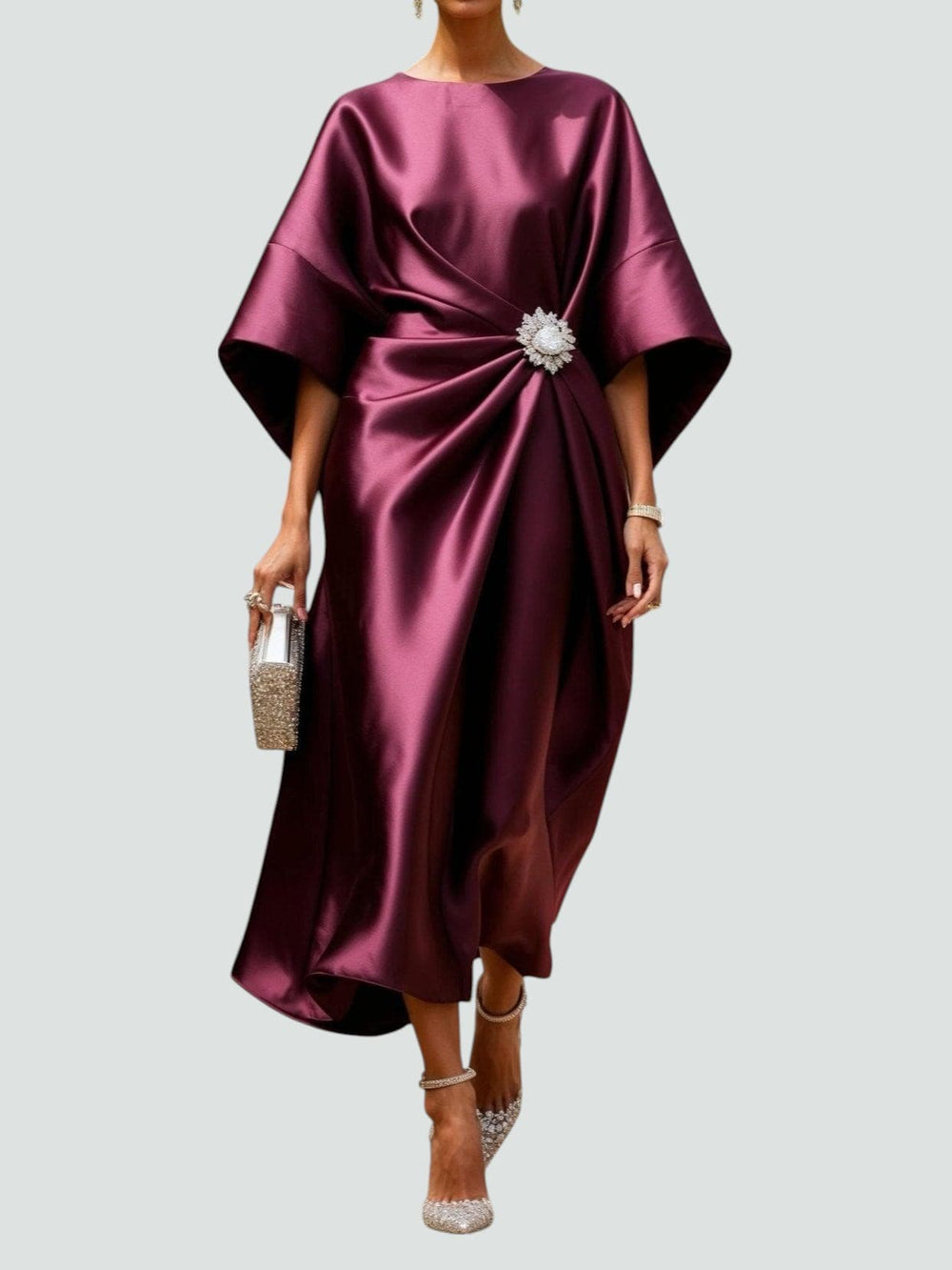 Long satin dress in deep magenta with batwing sleeves and jeweled waist ring detail