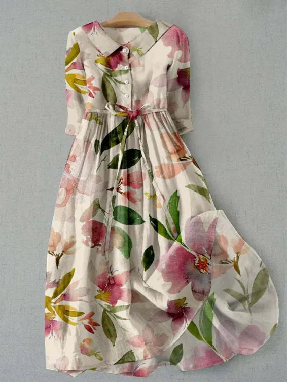 Floral midi dress with pink-and-cream print, green leaves, button front and tied waist.