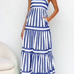 Navy and white striped maxi dress with tiered ruffle layers and spaghetti straps