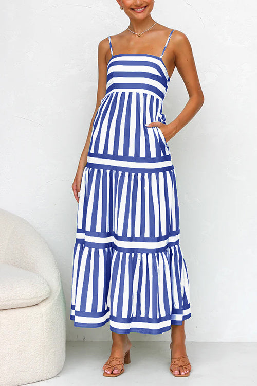 Navy and white striped maxi dress with tiered ruffle layers and spaghetti straps