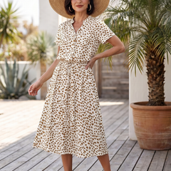 White printed button-front belted midi dress with short sleeves and V-neck