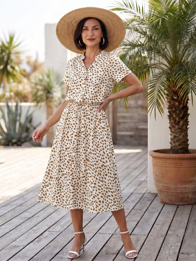 White printed button-front belted midi dress with short sleeves and V-neck