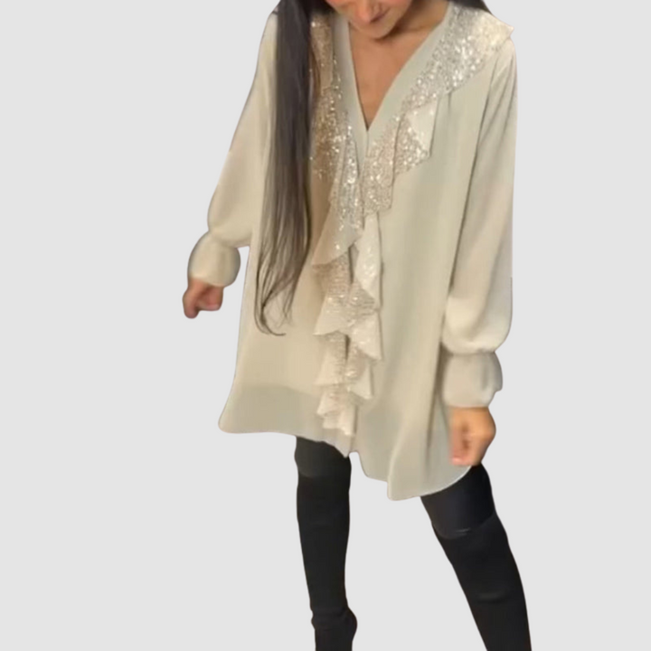 Light beige ruffled blouse with sparkly sequin neckline, long sleeves, tunic length