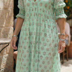 Mint green printed midi dress with V-neck and puff sleeves, gathered waist