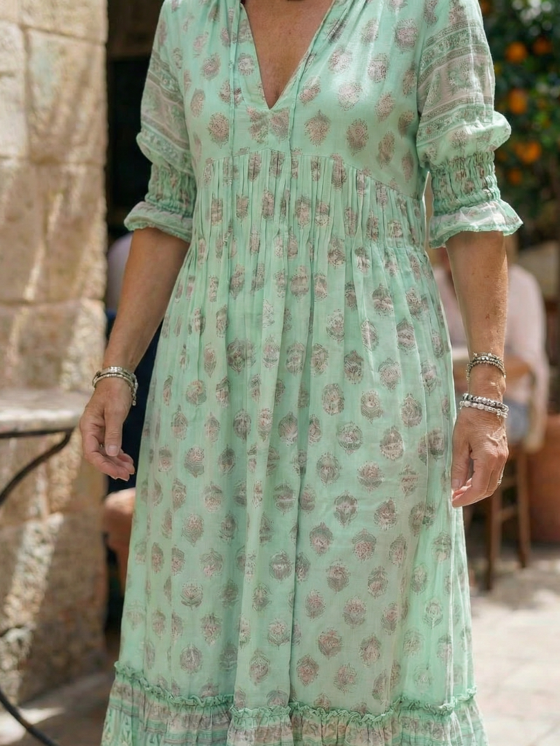 Mint green printed midi dress with V-neck and puff sleeves, gathered waist