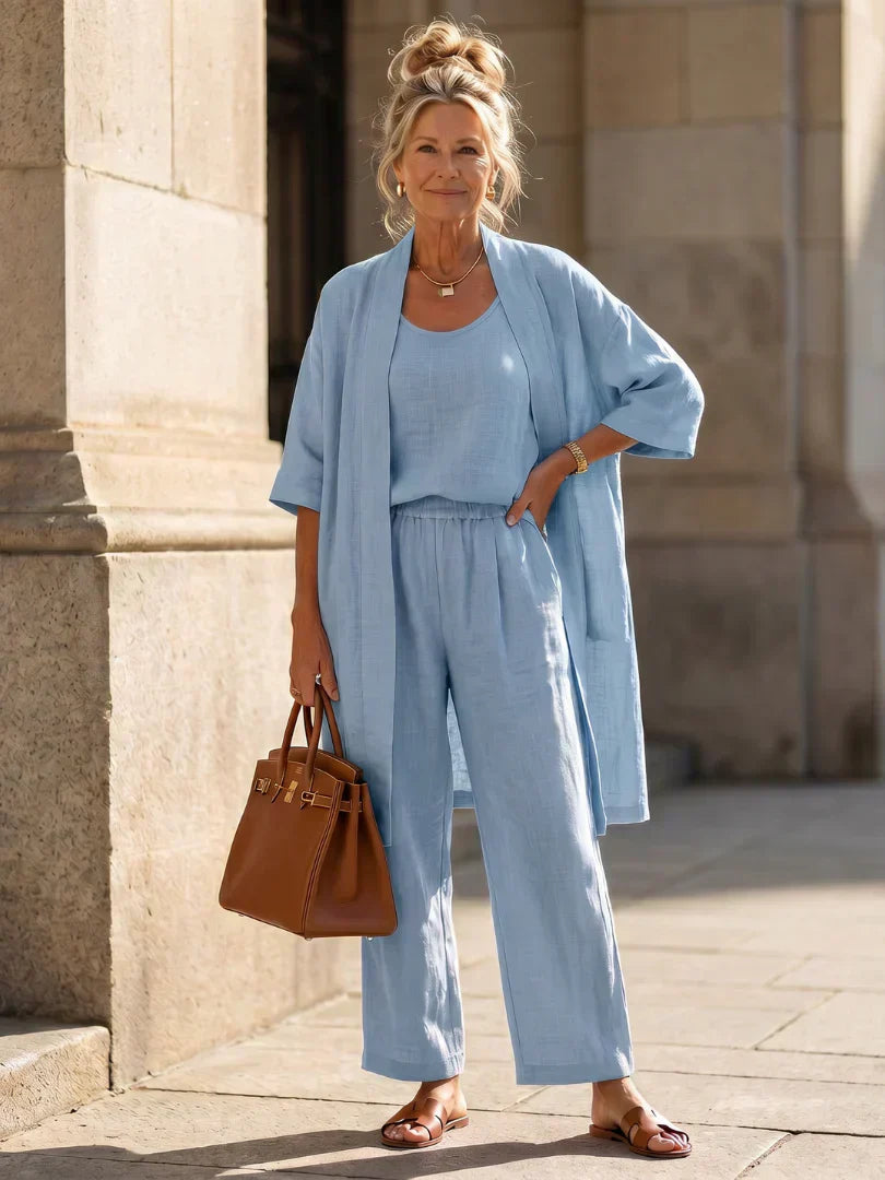Light blue women's elegant set: short-sleeve cardigan over matching wide-leg pants