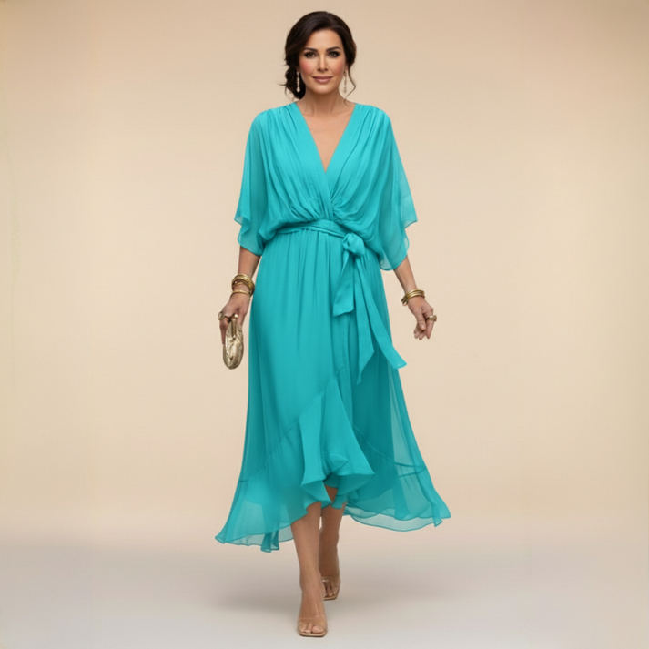 Teal V-neck wrap dress with tied waist and flowing chiffon midi length