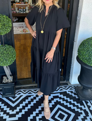 Black tiered maxi dress with short sleeves and V-neck