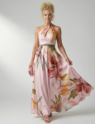 Light floral maxi dress with halter neck; cream base with pink flowers and green leaves