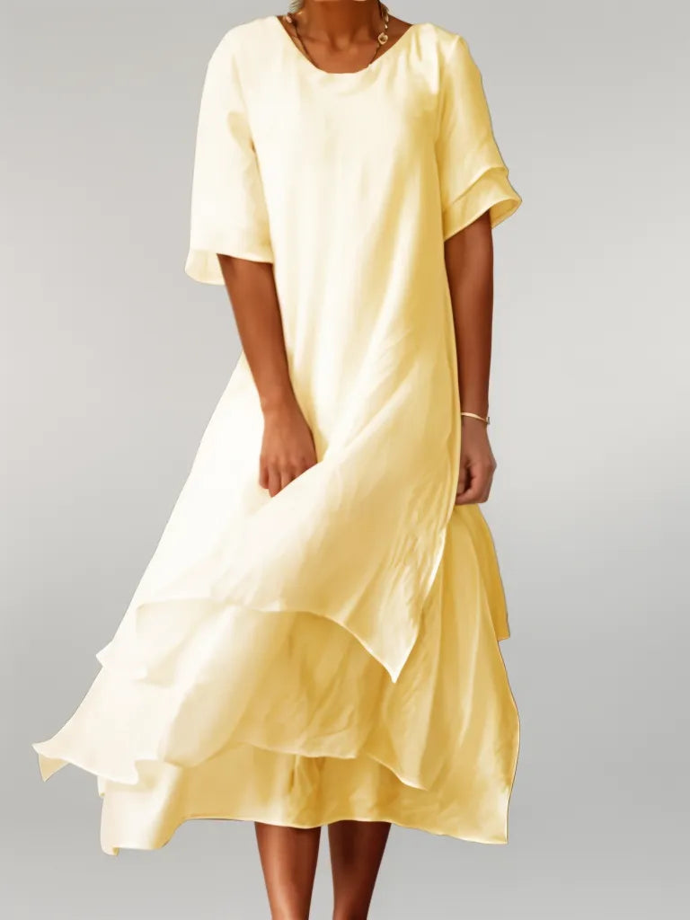 Yellow cotton long dress with short sleeves, round neck, and layered ruffle hem