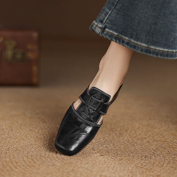Black genuine leather mule with strap buckle, low block heel, pointed toe
